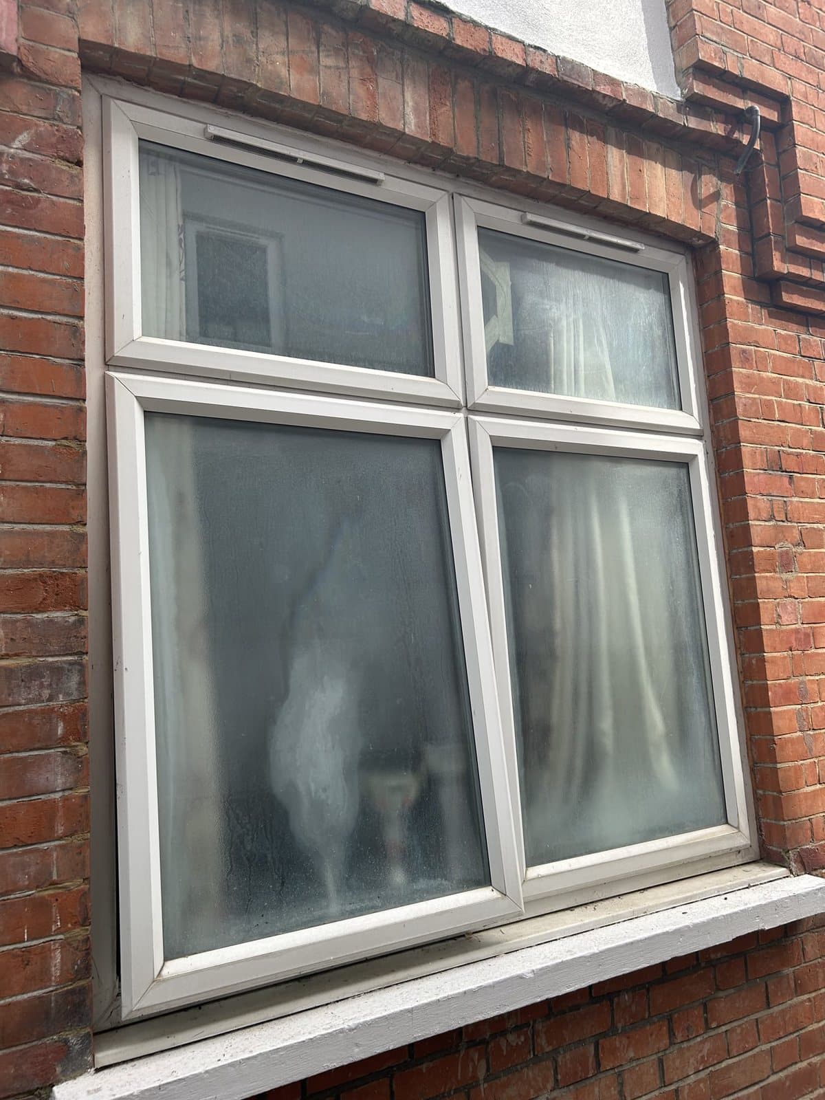 Blown double glazing replaced — before, Surrey